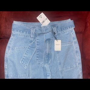 Forever 21 Denim light wash blue jeans with tie belt.